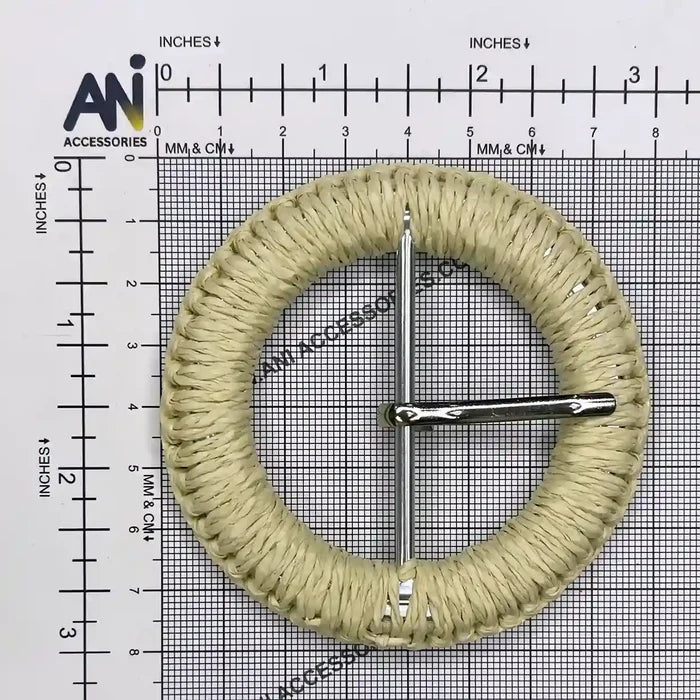 Ani Accessories DIY Circle woven cream Raffia buckle size with prong placed on a size chart graph