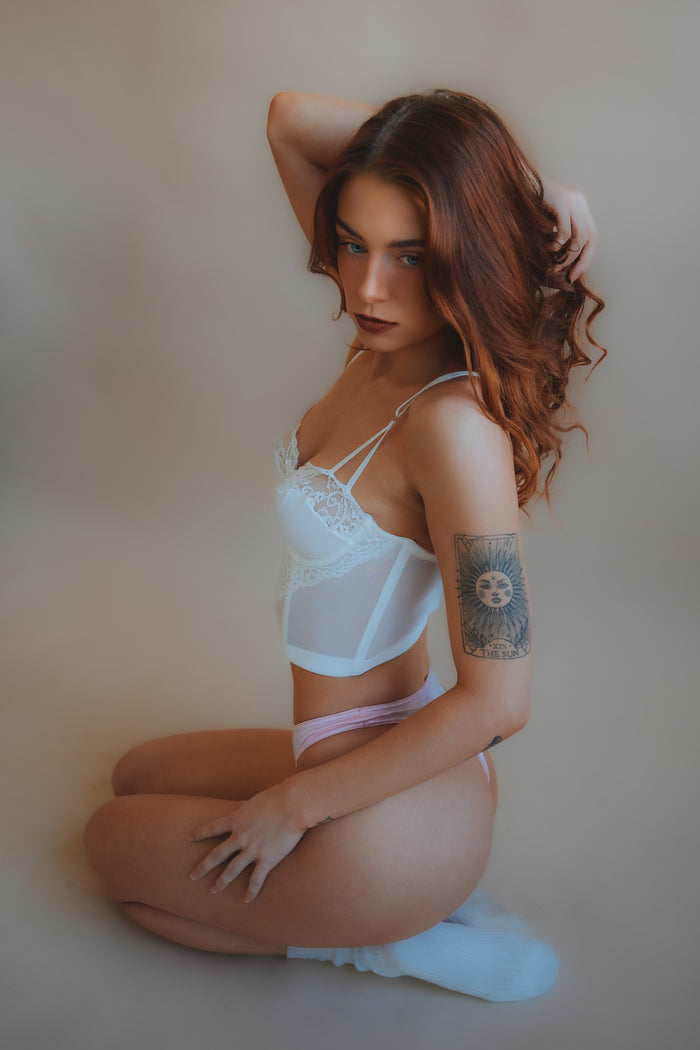 Light pink satin thong panties, smooth front and minimal coverage