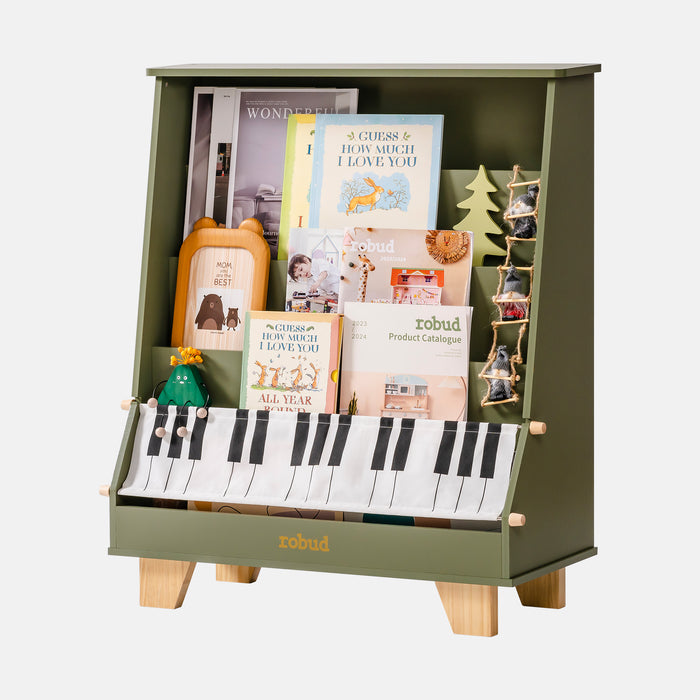 ROBUD Wooden Kids Bookshelf Piano WF008 green version front display with gnome and tree decorations on top showing the olive green cabinet shelves stocked with picture books and the piano key fabric tote bag