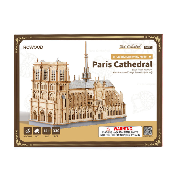 Rowood Paris Cathedral TG511 assembled wooden puzzle displayed on a wooden cabinet top against a white wall with a palm leaf visible, showing the full side-view profile