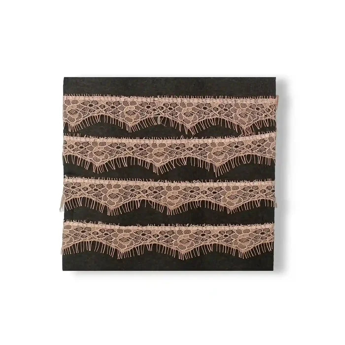 Buy now Peach Eyelash Trim Lace Fabric by Ani Accessories with delicate wave patterns and fringing details