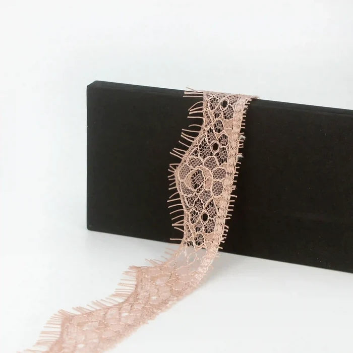 Buy now Peach Eyelash Trim Lace Fabric from Ani Accessories with delicate floral patterns and soft texture