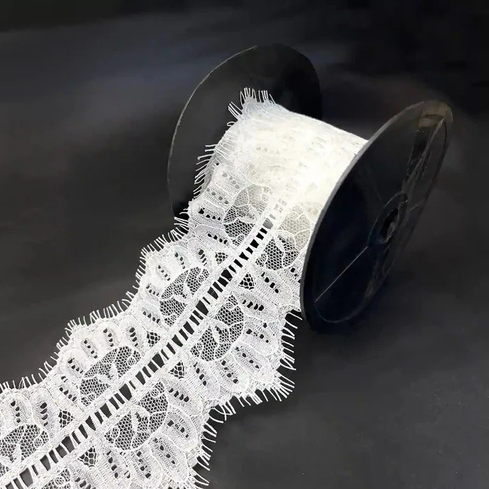 Buy Lace Fabric Premium Soft & Elegant Lace | Ani Accessories on a spool, showcasing its intricate design and texture