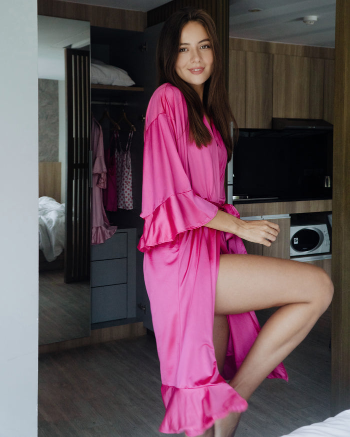 Bright pink satin long robe with tie belt and flared sleeve cuffs, open front