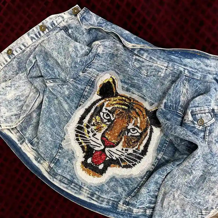 Ani Accessories Tiger’s Roar beaded sew patch on denim with intricate bead and sequin detailing
