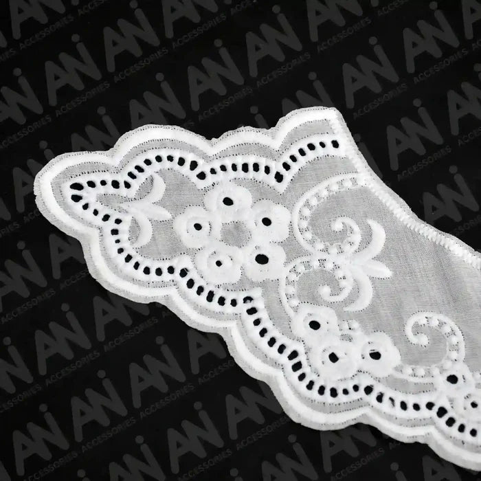 Close up shoot of Broderie Anglaise collar by Ani Accessories featuring classic eyelet embroidery for elegant garment detailing.