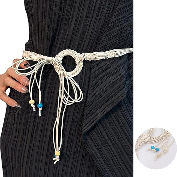 Ani Accessories Womens Belt Beige macrame belt with cowrie shells, styled over a gray dress. The belt threads through a large woven ring and hangs down.