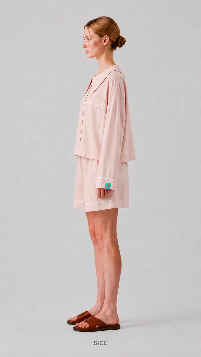 side view Woman wearing the PEKGEE Dream Of Tone Dream Petal Korean cotton linen pyjama set long sleeve short pants.