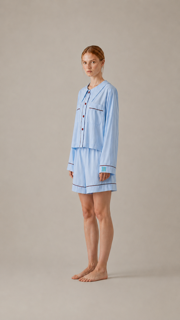 side view Woman wearing the PEKGEE Dream Of Tone Silent Flame Korean cotton linen pyjama set long sleeve short pants.