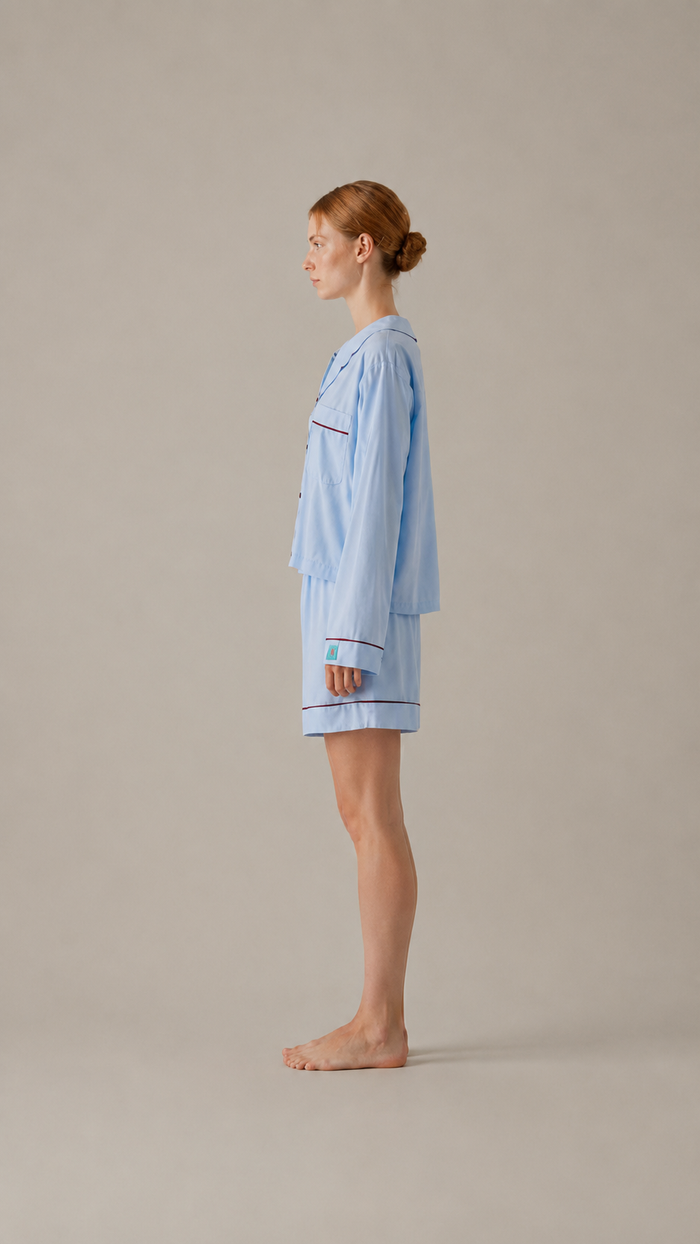 side view Woman wearing the PEKGEE Dream Of Tone Silent Flame Korean cotton linen pyjama set long sleeve short pants.