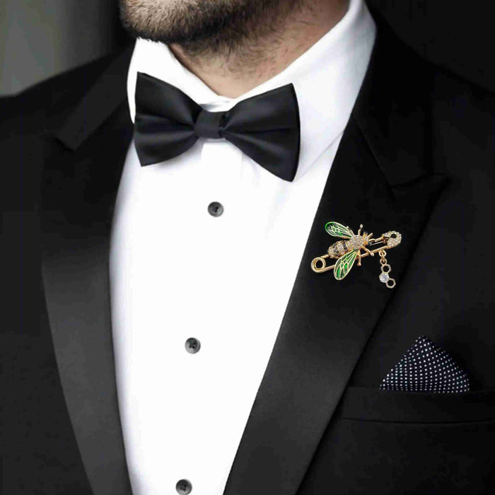 Man wearing a black tuxedo with bow tie styled with Ani Accessories bee safety pin brooch on the lapel.
