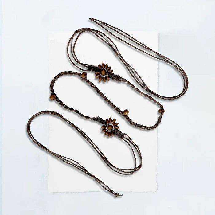 Ani Accessories Three braided hair ties with floral ends on a white background