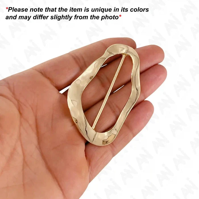 Ani Accessories Irregular Wave Shape Metal Buckle on the palm of hand with written text of product may slightly differ from the image.