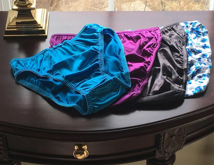 Princess panty set with four ruffled pairs in blue, purple, black, and patterned