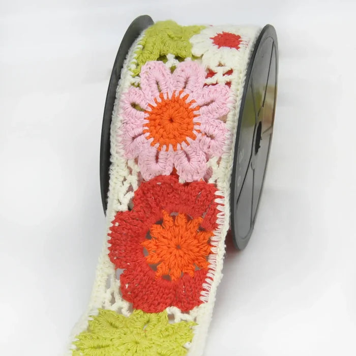 Colorful crochet lace with floral patterns  on lace roll in a white background