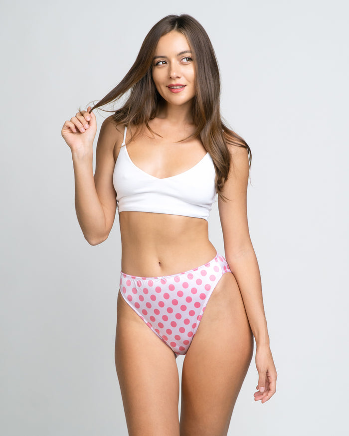 Pink polka-dot panty with scalloped white lace trim, standing pose