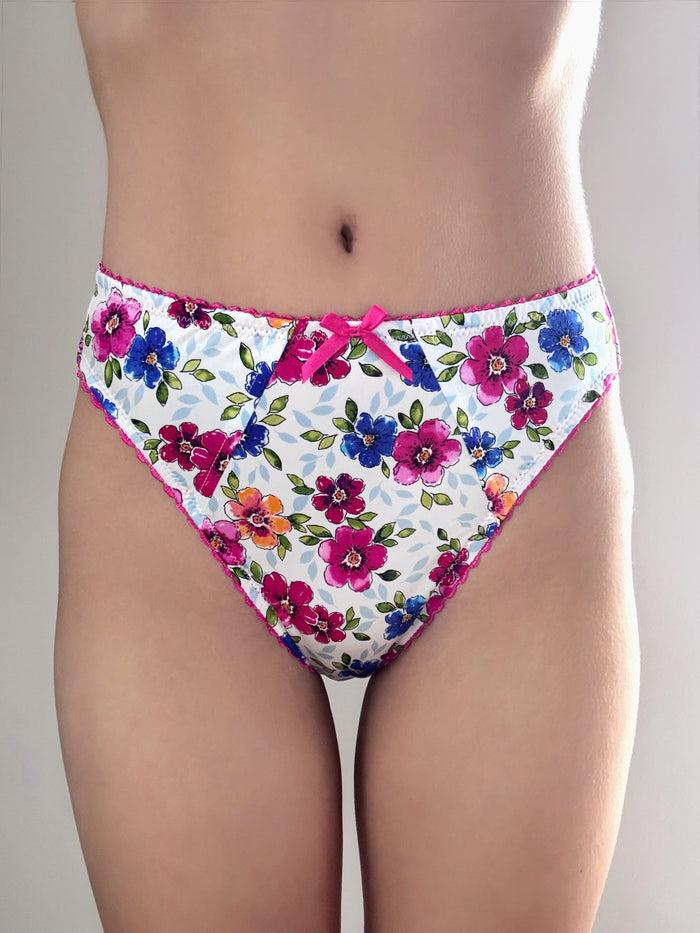 Floral panties with pink bow at front, white base with red, blue, and pink flowers