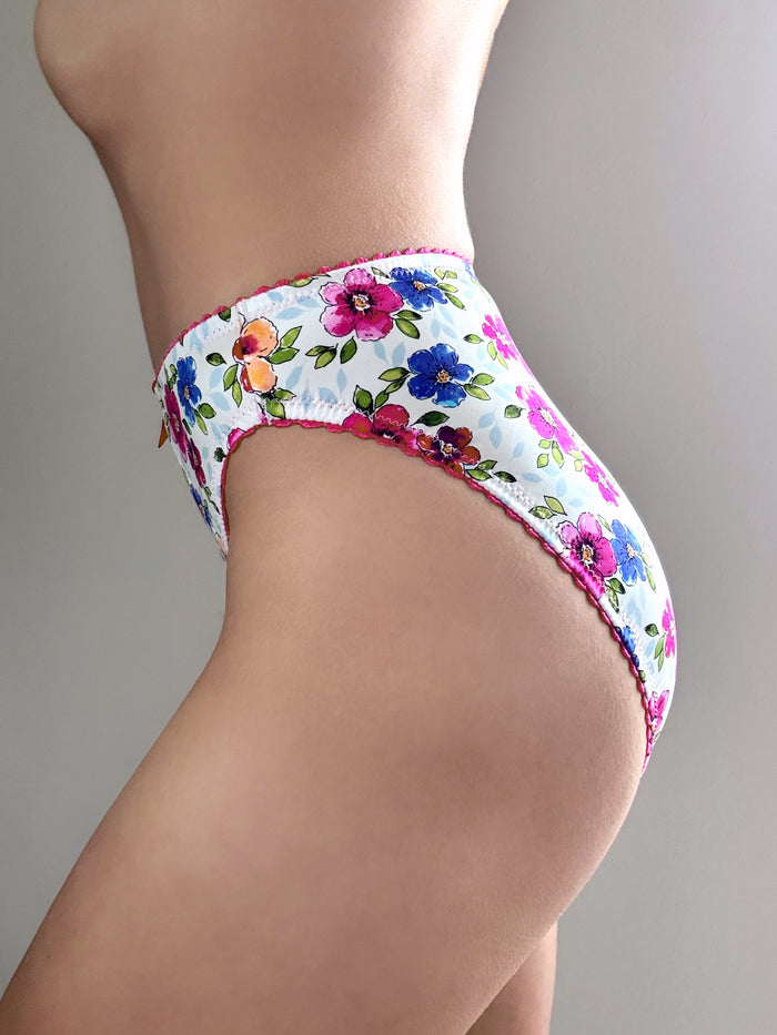 Floral hipster panties, white with colorful flower print and pink-trim edges