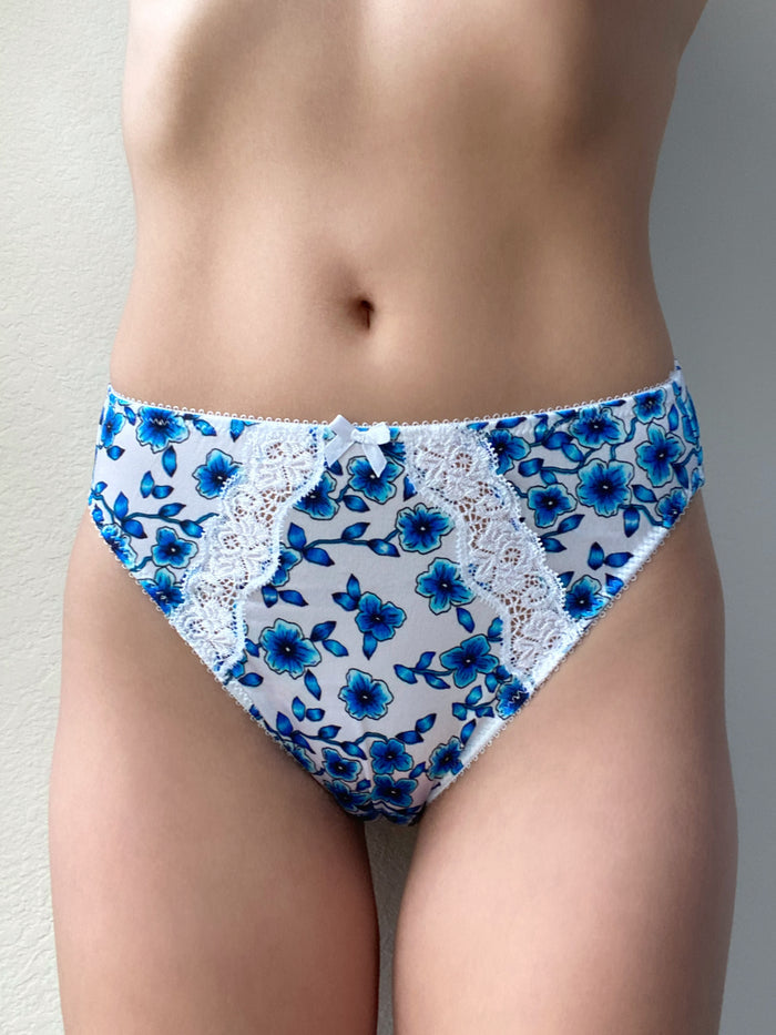 Blue floral bikini panty with white lace detailing at the front and sides