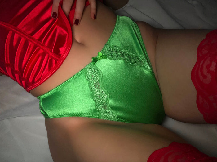 Lucky green satin panty with lace trim and triangle cut, close-up front view