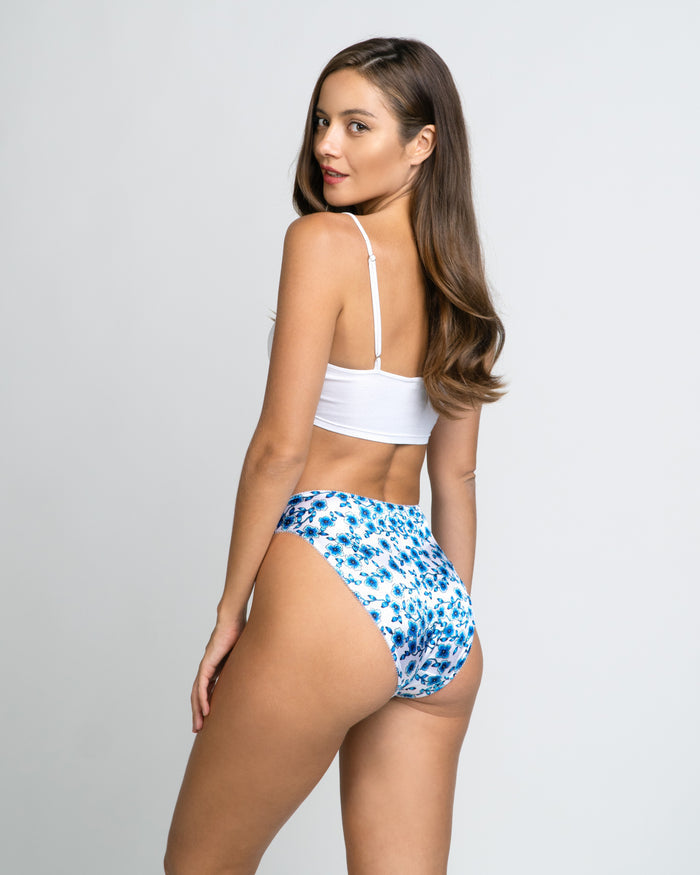 Women’s blue floral high-cut panties with elastic waistband and leg openings.