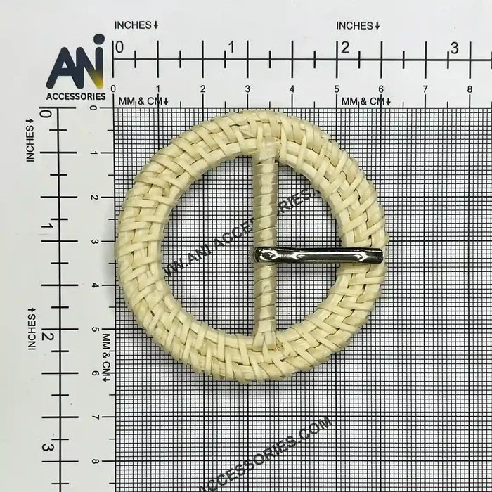 Ani Accessories Circular woven cream raffia buckle placed  on size chart  graph