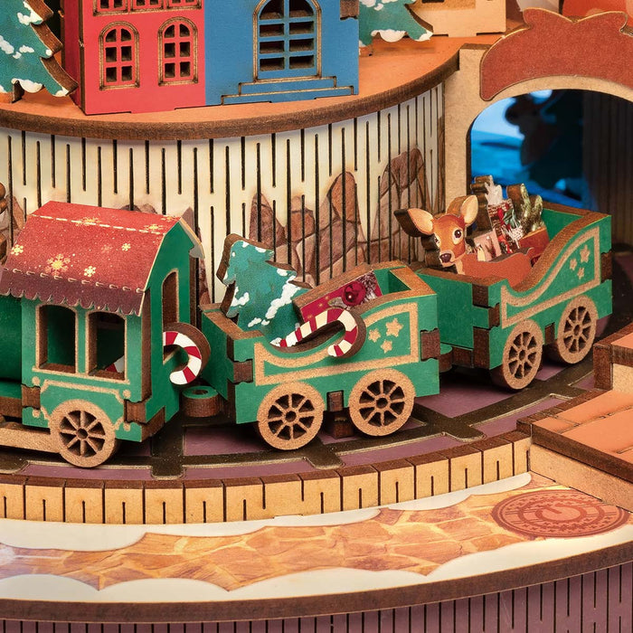 Rolife Christmas Melody Tree AMS01 detail close-up of the wooden candy cane Christmas train circling the illuminated village base platform
