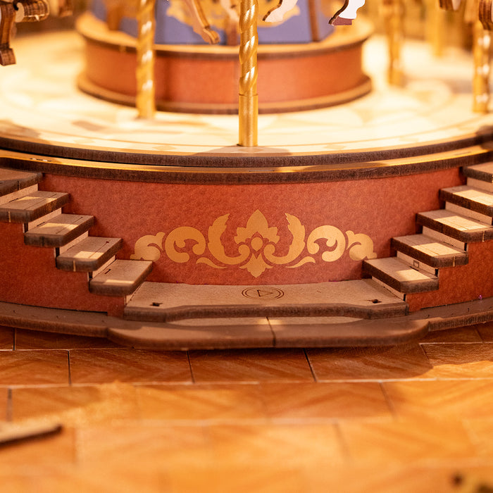Rolife Classic Carousel AMC01 Music Dreamer close up of the ornate wooden base with golden fleur de lis scrollwork and Type C charging port