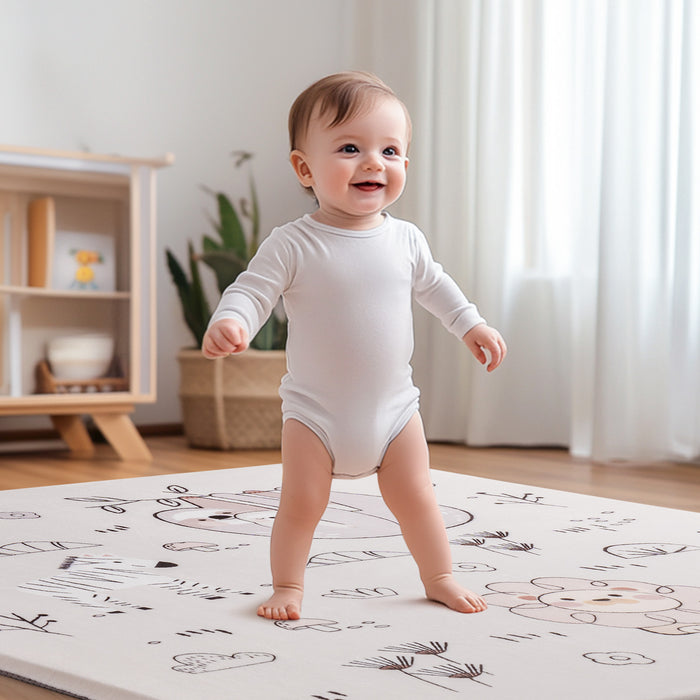 ROBUD baby play mat laid flat showing full safari sloth, zebra and lion print design with a corner folded back showing the grey underside and 1.2in thickness callout