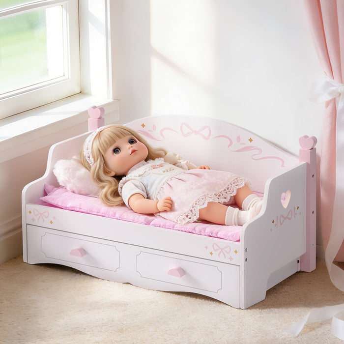 Baby doll resting on ROBUD white wooden doll sofa bed with pink lace quilt and heart cushion near a sunny window