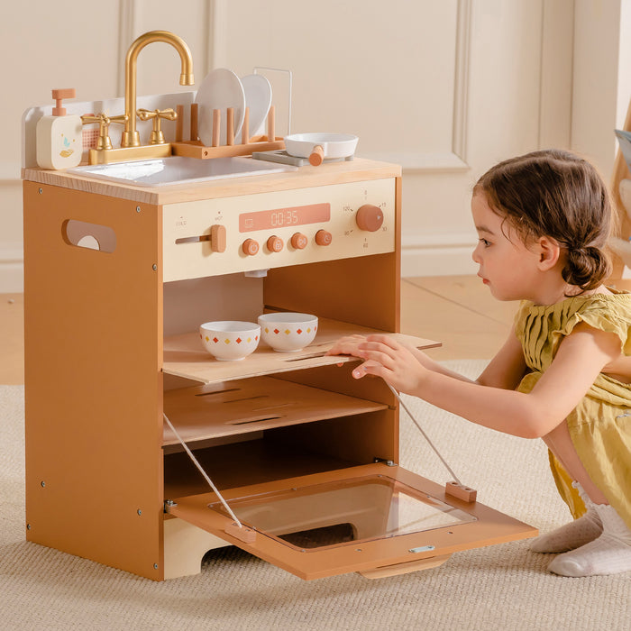 Toddler girl in yellow dress pulling out the lower drawer tray of ROBUD Wooden Caramel Dishwasher in nursery setting