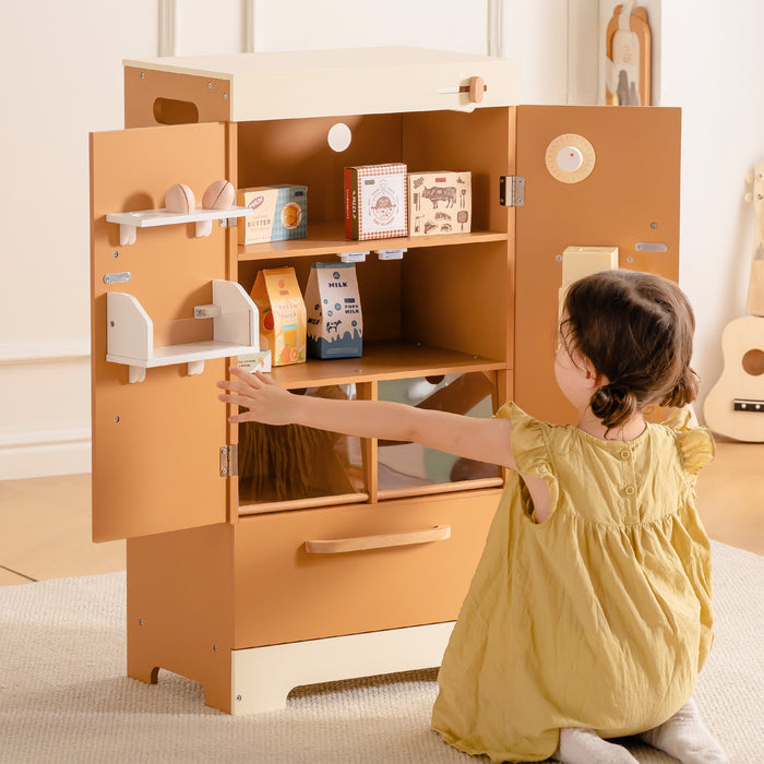 Young child in yellow dress exploring ROBUD Wooden Caramel Refrigerator with open door revealing play food items inside