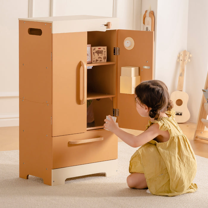 Toddler girl in yellow dress opening the door of ROBUD Wooden Caramel Refrigerator toy in warm caramel wood tones