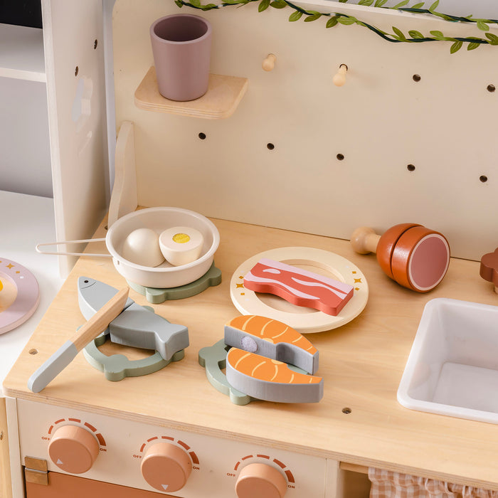 ROBUD wooden meat cutting playset on a natural wood play kitchen countertop with salmon on plate, egg in pan, bacon on serving plate, and fish with knife