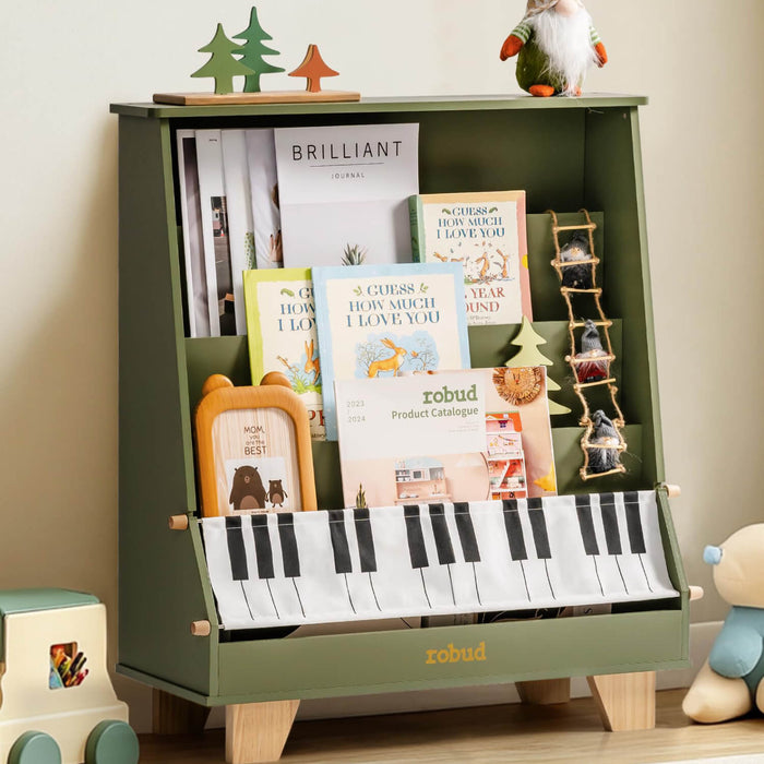 ROBUD green wooden kids bookshelf with piano keys panel at the base, holding colorful children's books and small decorative trees on top