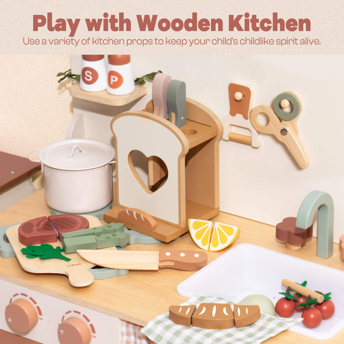 ROBUD wooden play kitchen set up showing toast holder, steak on cutting board, asparagus pieces and a sage-green handled toy knife beside a white ceramic cup