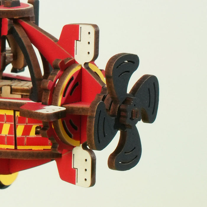 ROKR Deep-Sea Adventurer Gravity Swing MCD04 red and black wooden steampunk submarine leaning sideways showing assembled front detail against sage-green wall