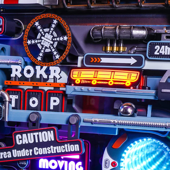 ROKR Last City control panel detail with gauge, arrows, warning labels, and blue light.