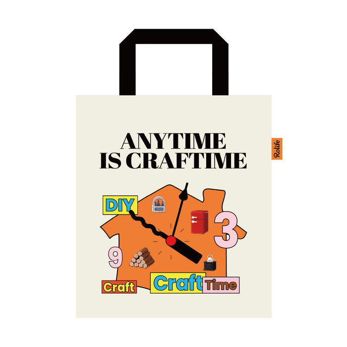 Cream craft tote bag with black handles and colorful DIY lettering