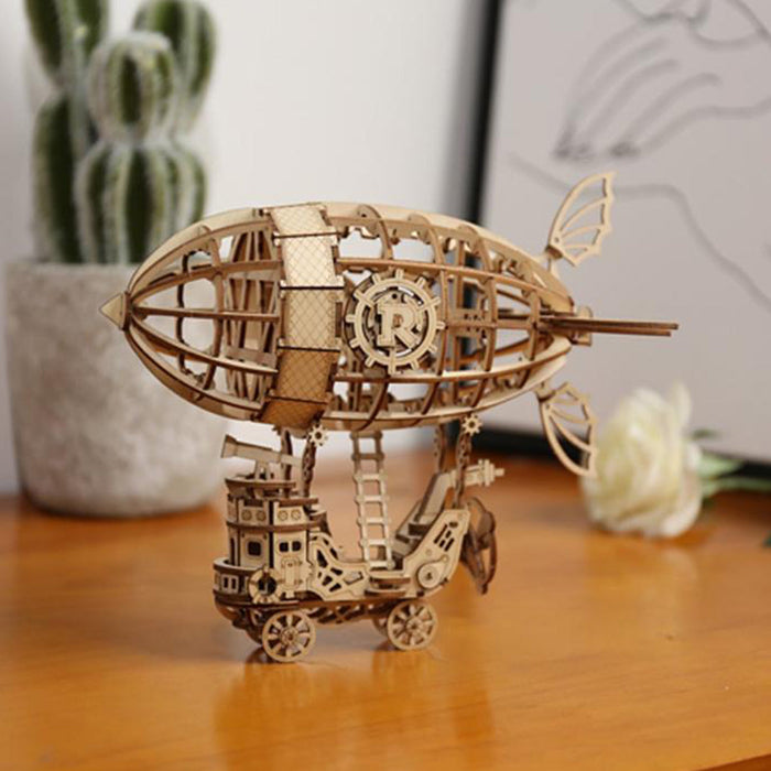 Rolife Airship TG407 3D wooden ship model kit, completed model displayed on a shelf