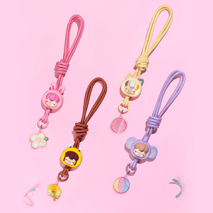 Rolife Baby Nanci Fluffy Party Phone Chain PZC05 cat character charm shown on a yellow braided cord as a phone wrist strap