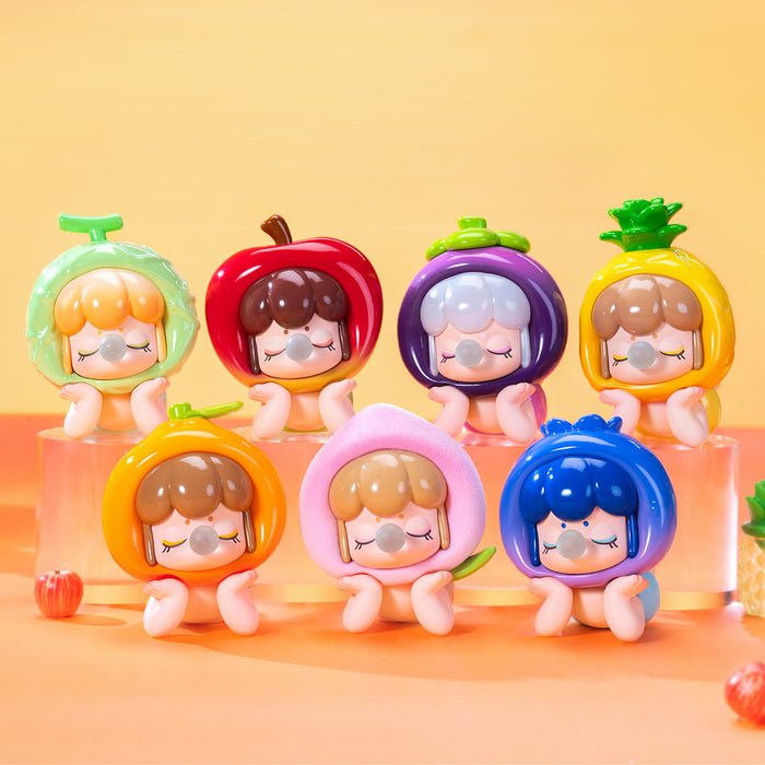 Rolife Baby Nanci Fruits complete set of seven fruit costume figures displayed on a clear acrylic riser on an orange surface showing all designs from the collection at once