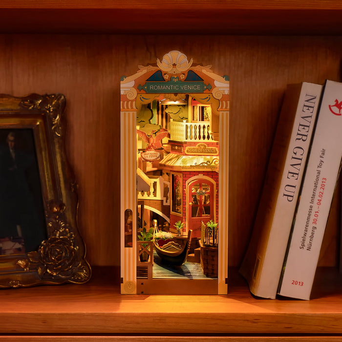 Rolife Romantic Venice TGB08 Book Nook with transparent dust cover being lifted showing the illuminated Romantic Venice canal interior scene