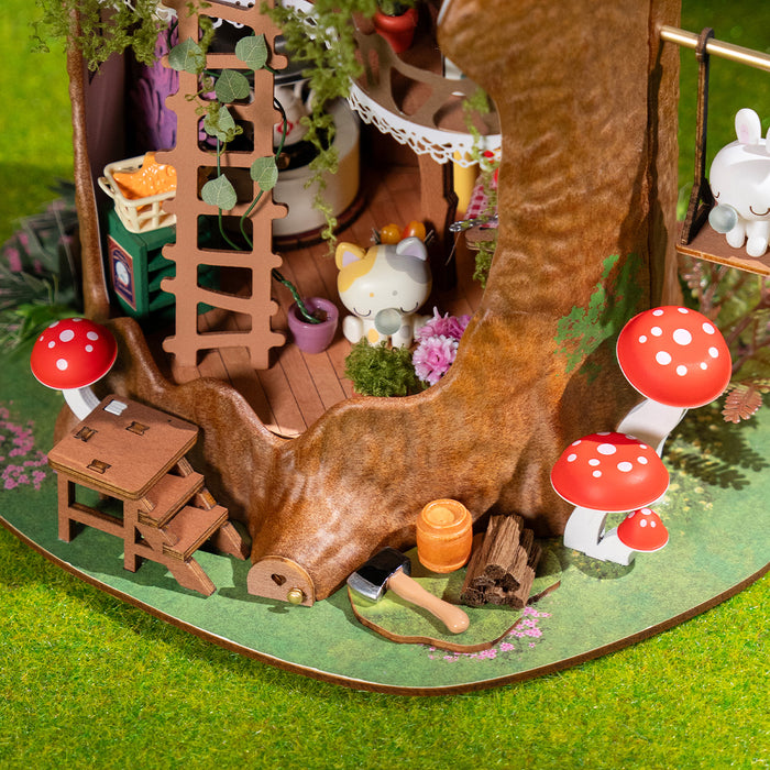 Rolife Fairytale Tree House DG179 miniature bedroom interior with a carved wooden bed, plaid pillow, treehouse diary, hanging bell, and red tiny boots on the floor