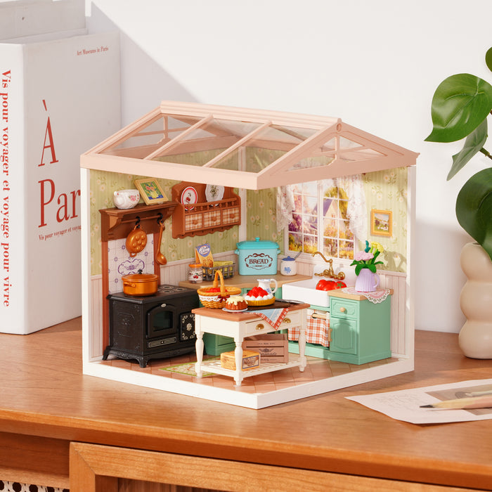 Rolife Farmhouse Kitchen DW024 miniature house on a desk showing a cozy country kitchen with vintage stove and pantry shelves