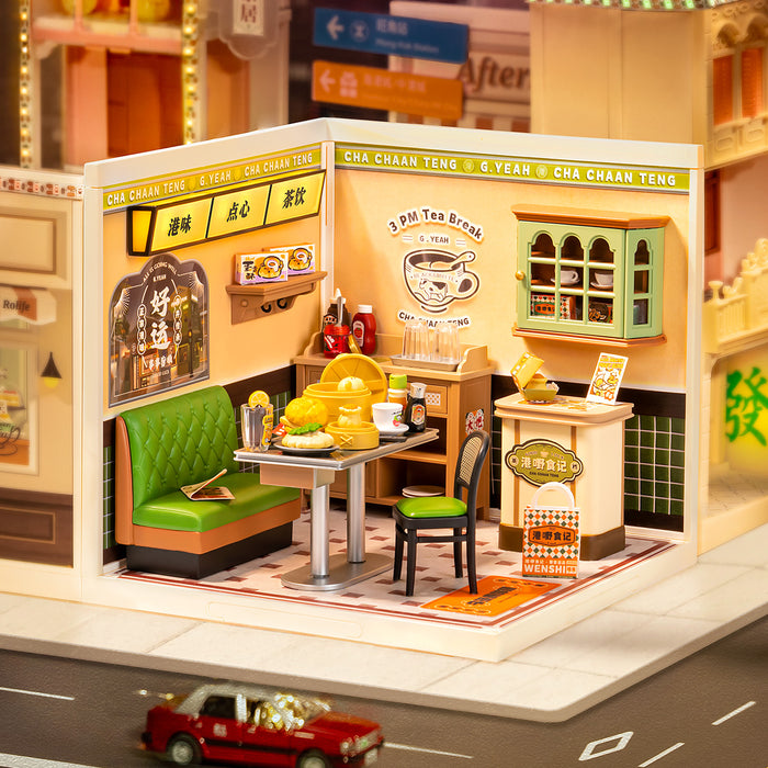 Rolife Super Creator Hong Kong Bites Cafe DW021 box packaging in sage green showing 114 PCS, LED lighting, DIY difficulty, and the completed room model preview