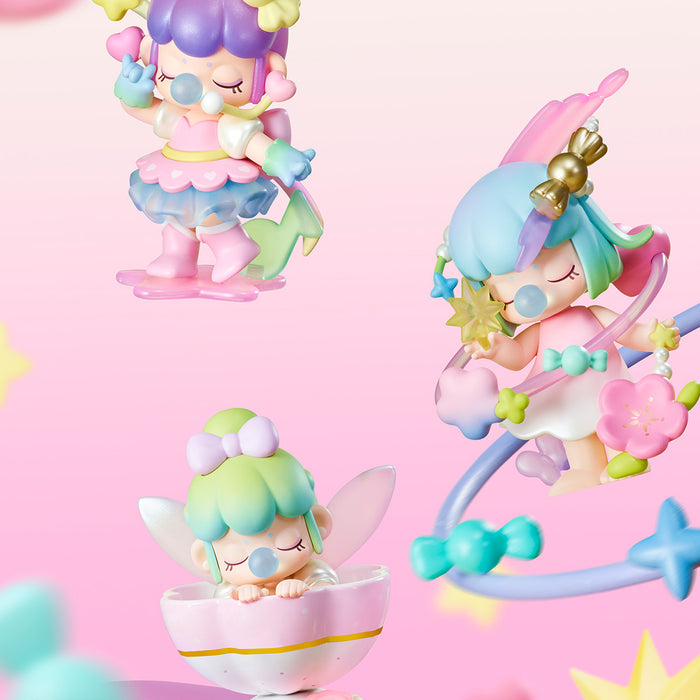 Three Rolife Nanci Sweet Time figures close-up against pink background with fairy in teacup, princess with halo wand, and glitter fairy doll in pastel tones