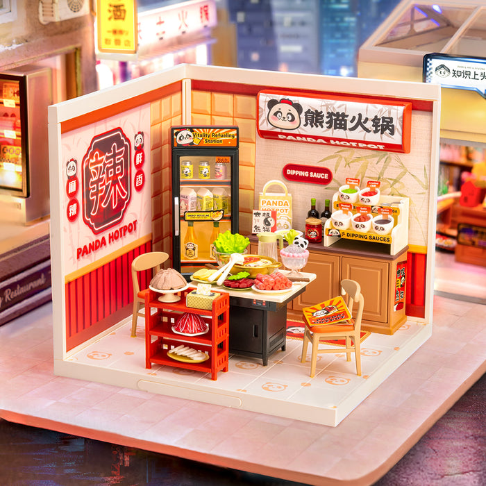 Rolife Panda Hot Pot DW020 miniature restaurant displayed in a city night scene with glowing panda branding, hotpot table, red ingredient trolley, and beverage fridge