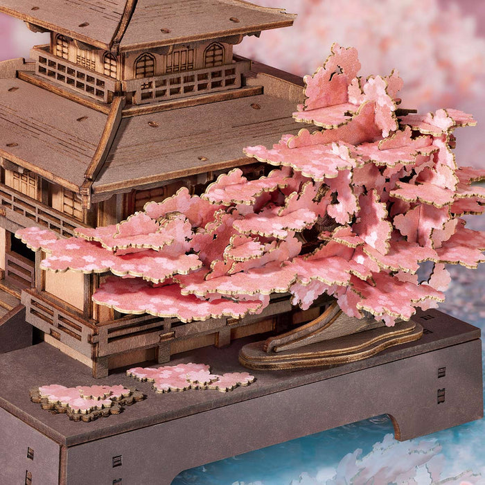 Rolife Sakura Pavilion close-up detail of dense pink cherry blossom canopy with blue mist base around the wooden pagoda