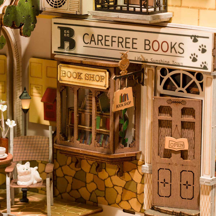 Rolife Sunshine Town book nook front facade showing Carefree Books shop with stone exterior and cat in the window